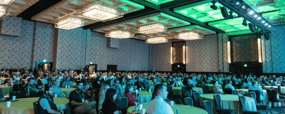 group of event attendees watching a franchise conference