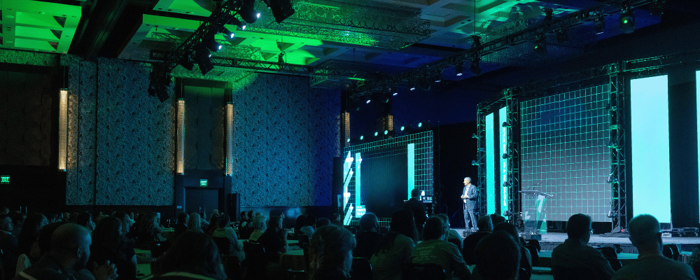 group of event attendees watching a franchise conference