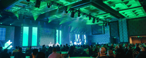 group of event attendees watching a franchise conference