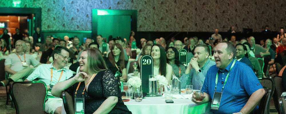 group of franchise owners watching a conference