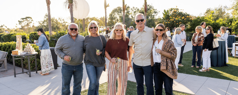 franchisees taking a group photo together during an event