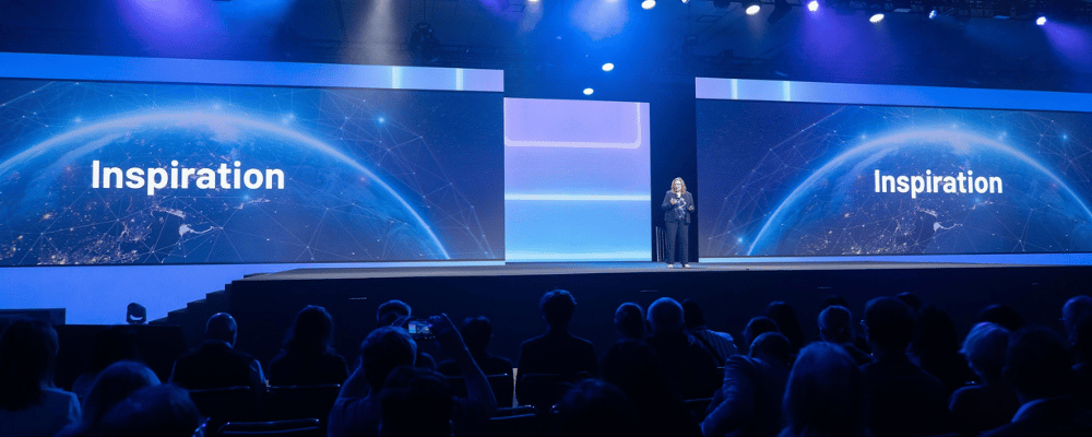 group of attendees watching a corporate conference