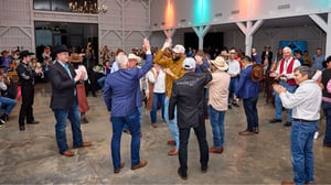 group of attendees during a conference dinner celebrating together