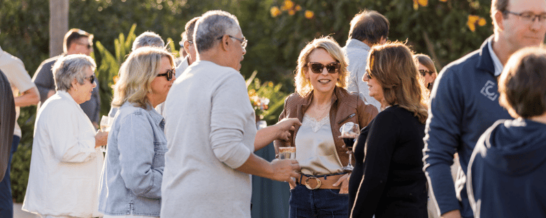 group of attendees networking before dinner at a corporate event