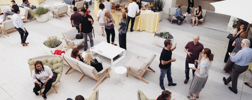 attendees networking in an outdoor meeting space venue