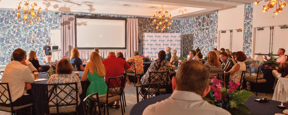 group of incentive trip attendees watching a presentation 