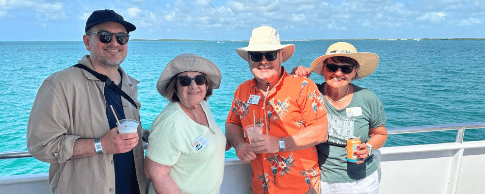 four attendees on a boat in key largo during a franchise incentive trip