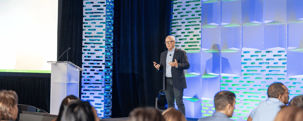 event attendee giving a presentation at a corporate conference