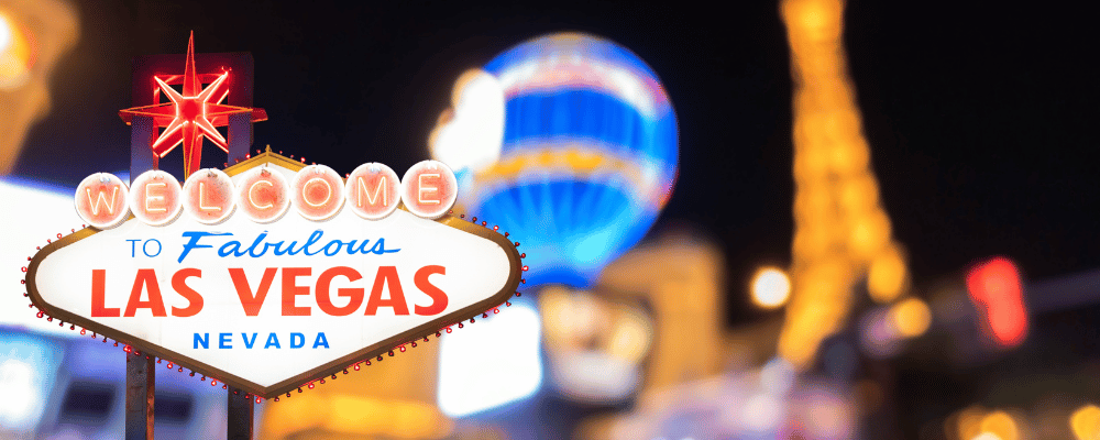 las vegas sign in front of the strip