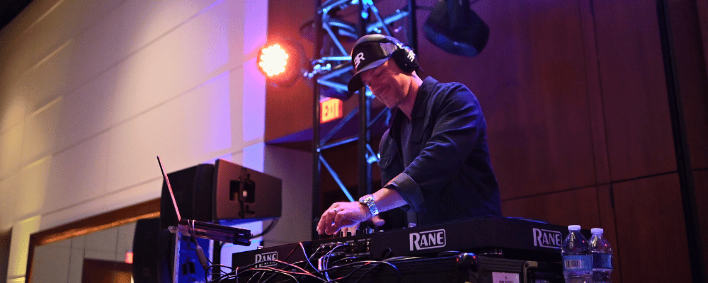 DJ playing music at a corporate user conference