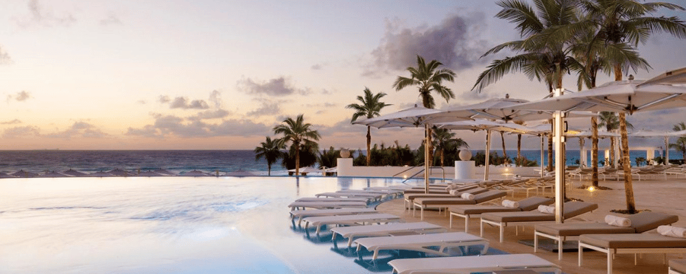 lounge chairs and pool at the leblanc resort