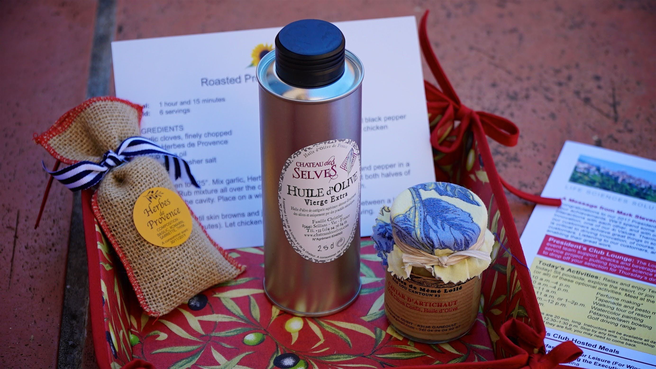 examples of local gifts for sales incentive trip, including olive oil and herbs from Mallorca
