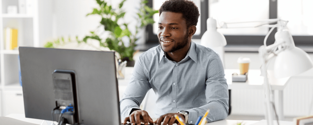 man reviewing sponsorship package options on his computer