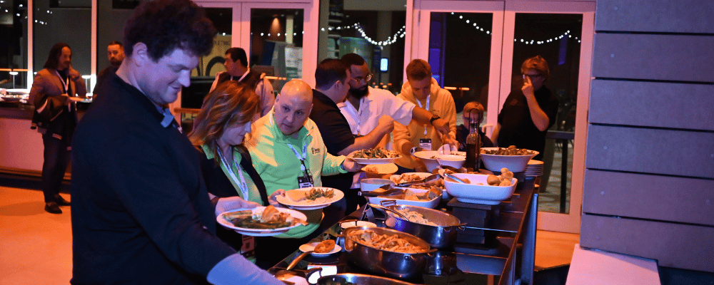 attendees at a corporate conference food buffet