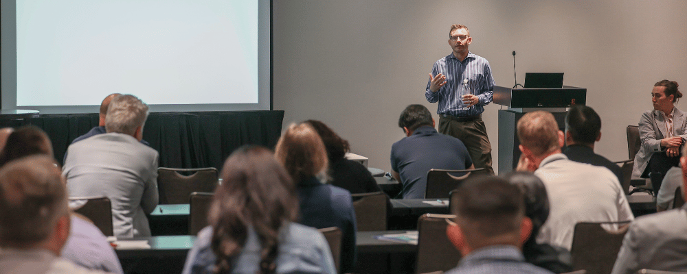 executive giving a presentation during a corporate meeting