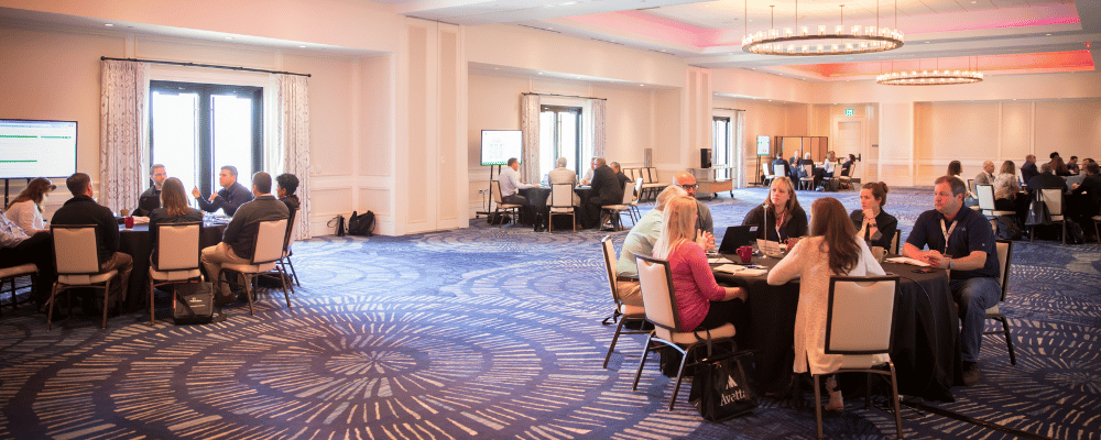 group of event attendees networking during a meeting