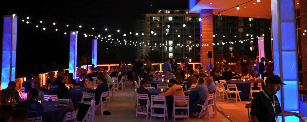 group of event attendees networking during an outdoor conference