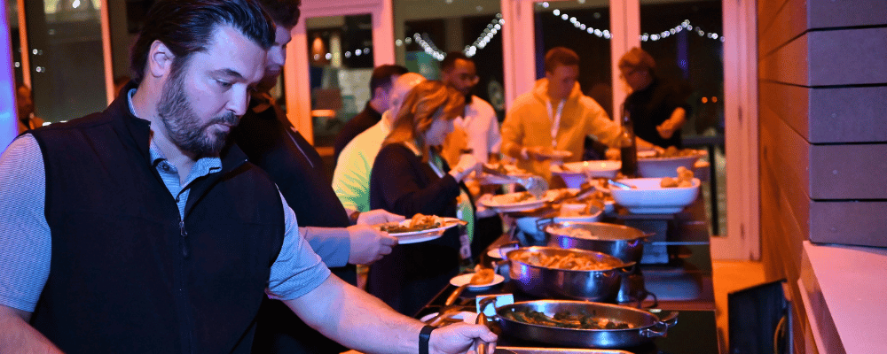 group of corporate conference attendees networking at a corporate event