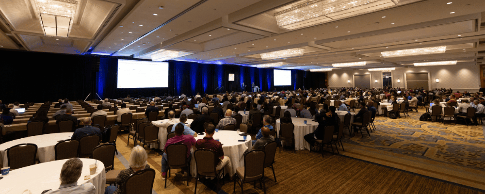 group of attendees watching a conference