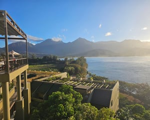 outdoor view from hotel room of beach and mountains