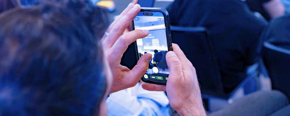 attendee taking a photo during a leadership meeting