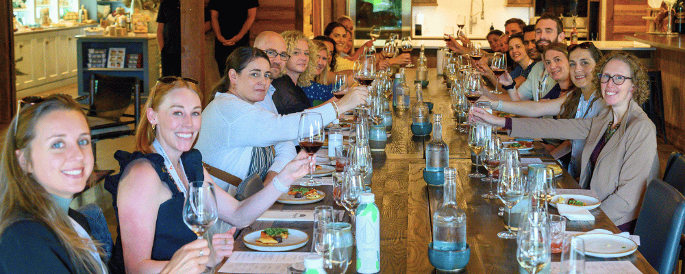 group of event attendees wine tasting