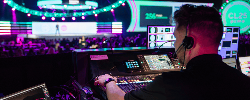 A/V producer setting the lighting at a conference