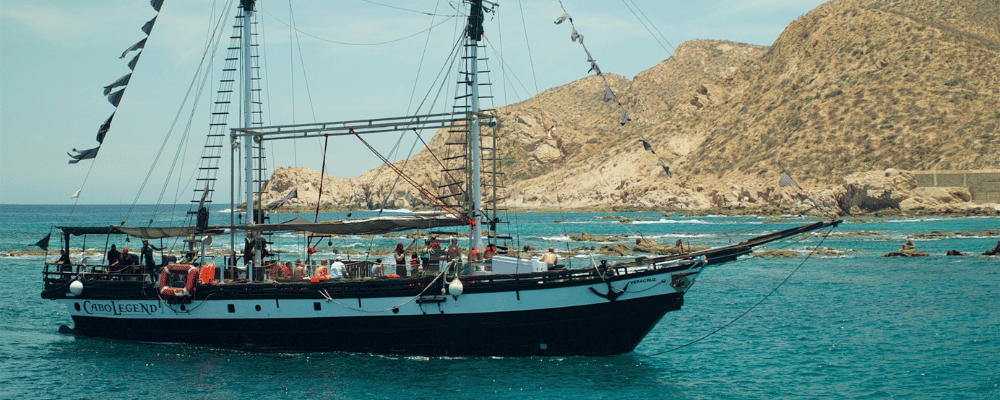 Group of people sailing on a boat in cabo san lucas, mexico
