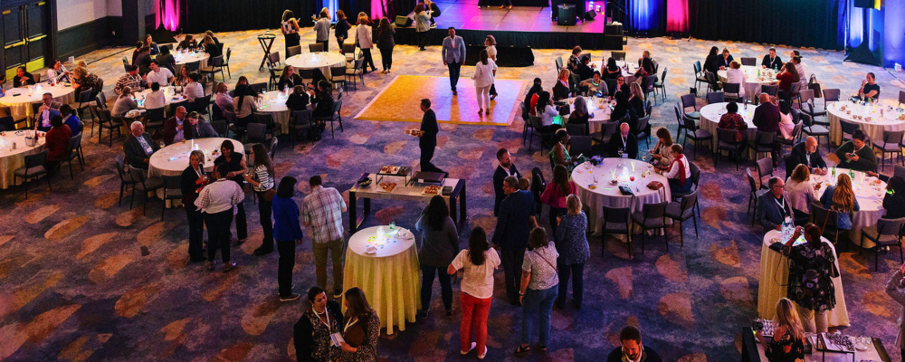 group of conference attendees networking at a corporate event