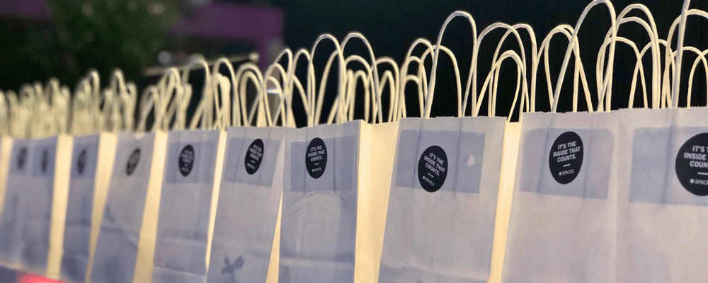 swag bags lined up at a conference