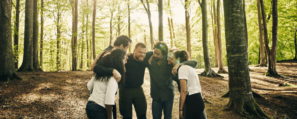 A group of employees participating in team building activities during a company retreat