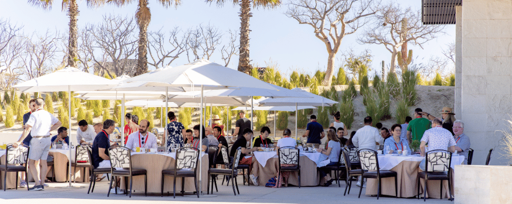 group of conference attendees enjoying breakfast during an incentive trip