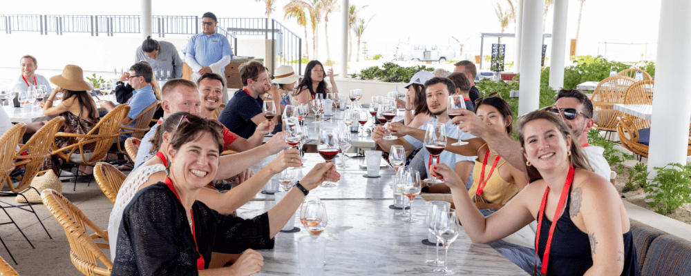 group of incentive trip attendees drinking wine during an event