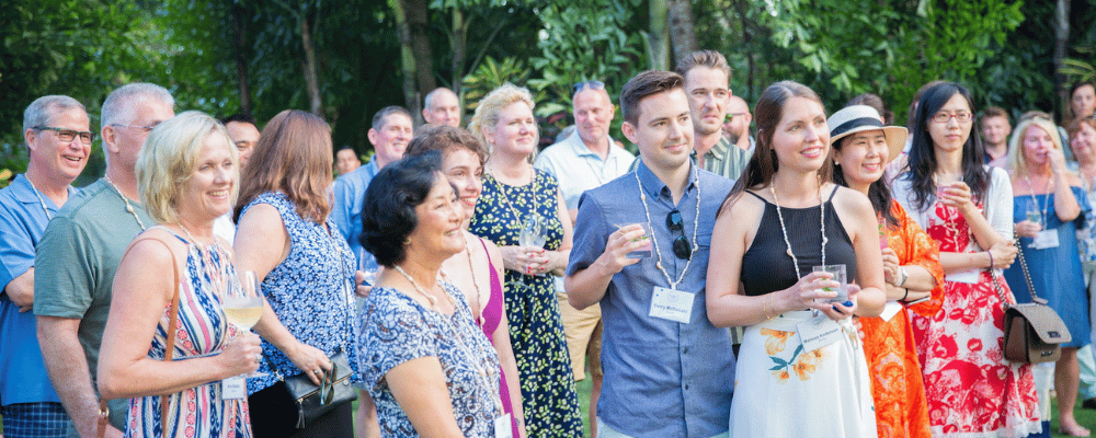 group of conference attendees listening to a presentation