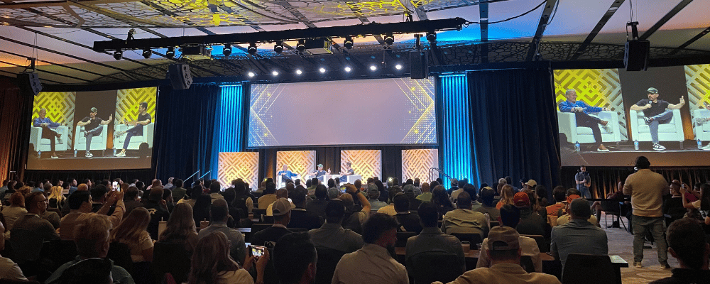 group of event attendees watching a corporate conference presentation