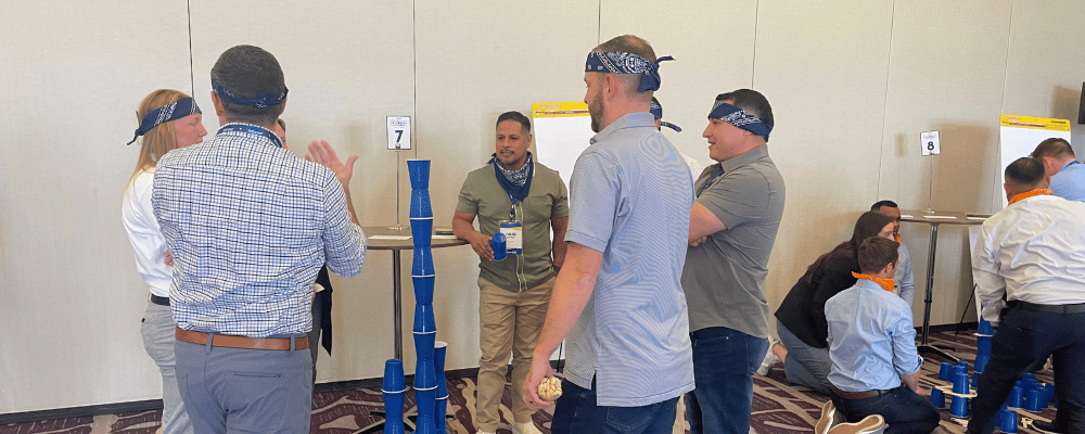 group of event attendees playing a game during a conference