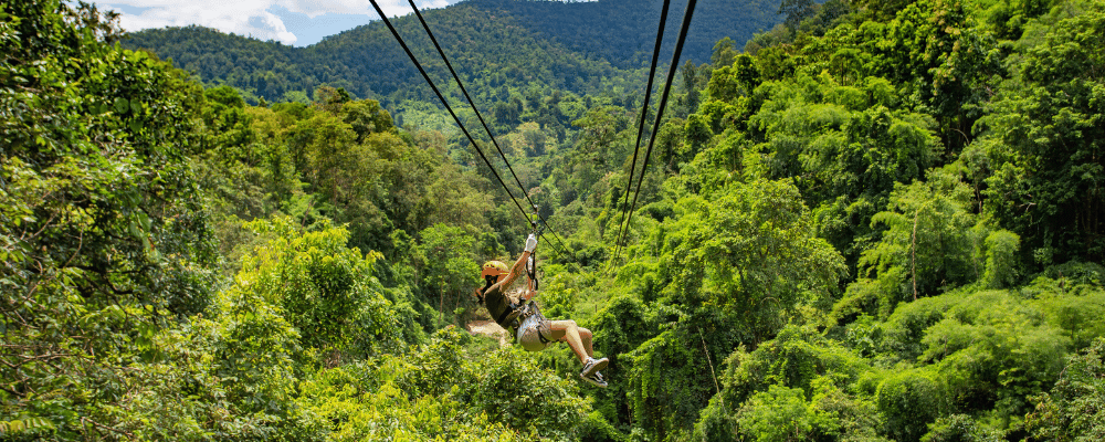 woman ziplining in jungle at an incentive trip