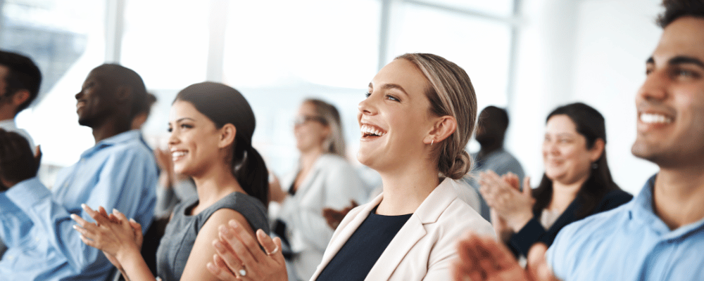 Group of attendees listening to presentation at a kickoff conference