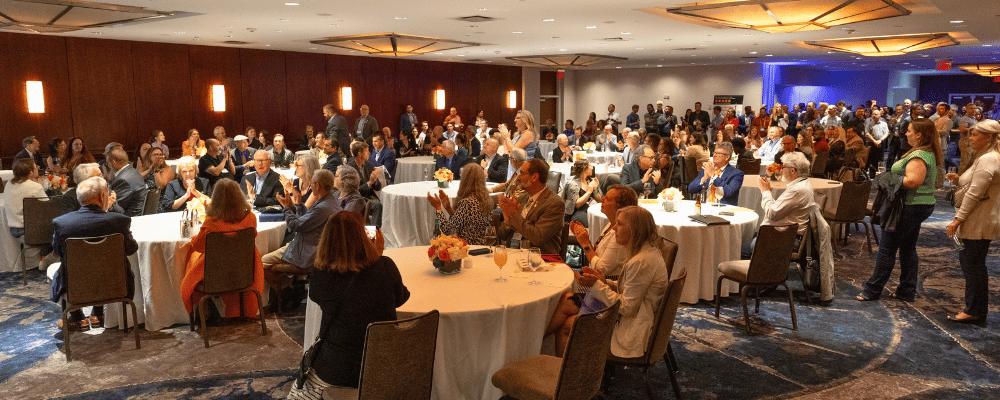 group of event attendees watching a corporate conference